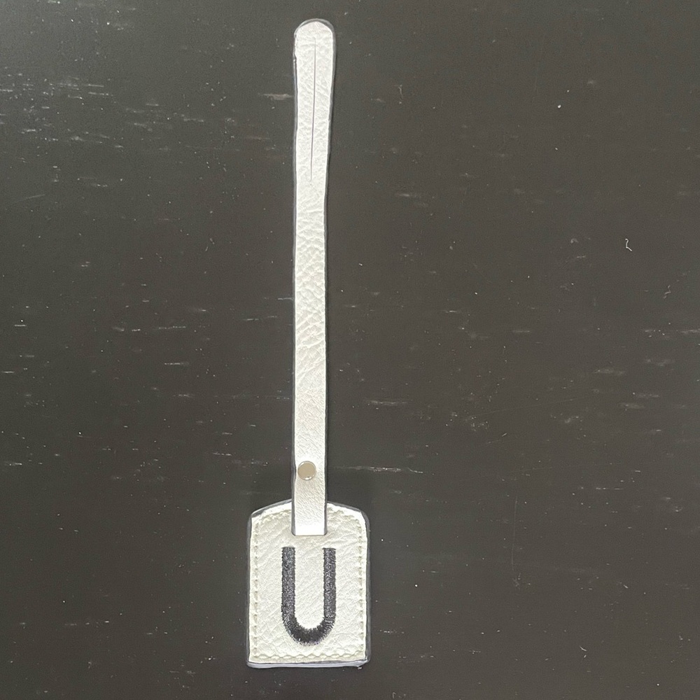 NWOT “K•Carroll” Bag Tag,  Monogram Letter "U" White Bag Tag with "Black Letter